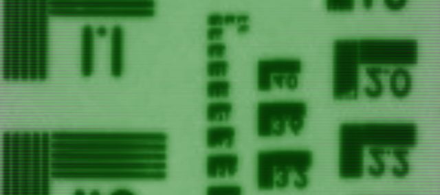 A washed out green video image of a puzzle cube.